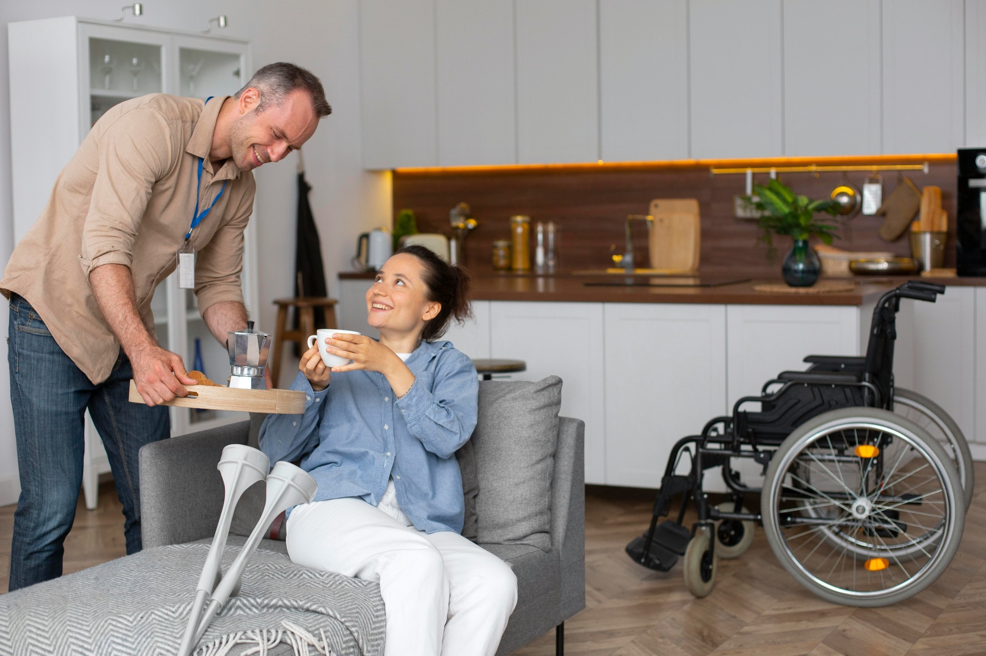 Compassionate nurse smiling with an elderly woman in a sunlit home